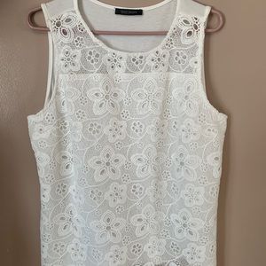 White sleeveless blouse.